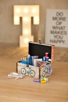 casket for needlework with flower, sewing in style interior
