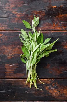 Organic sage on dark old wooden table top view