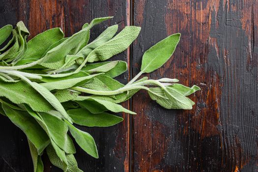 Sage on dark old wooden table top view