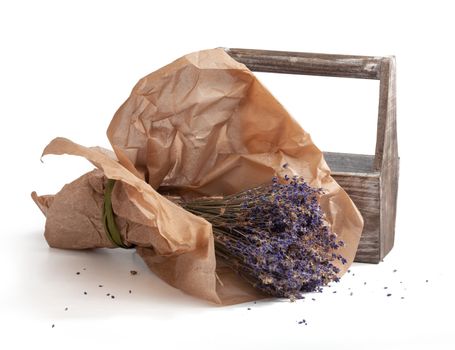 Isolated dry lavender bouquet in craft paper with wooden box