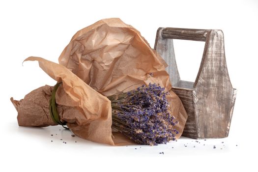 Isolated dry lavender bouquet in craft paper with wooden box