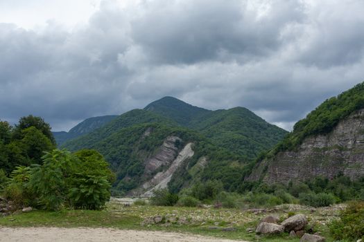 Ashe mountain river valley at the cloudy summer day