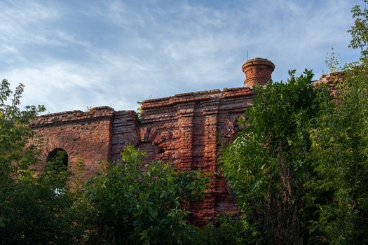 Ruins of brick building  in the trees