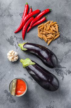 Aubergine penne arrabiata ingredients, top view.