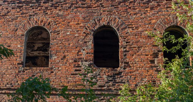 Old ruins of brick building in summer