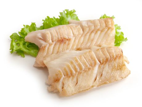 Two baked cod loin pieces with fresh green lettuce