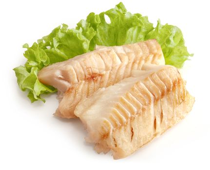 Two baked cod loin pieces with fresh green lettuce