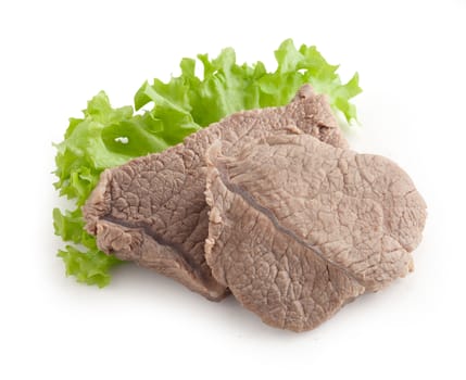 Isolated cooked beef and fresh green lettuce