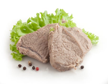 Isolated cooked beef and fresh green lettuce