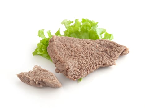 Isolated cooked beef and fresh green lettuce