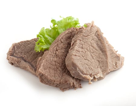 Isolated cooked beef and fresh green lettuce