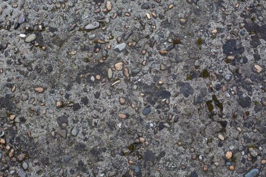 Concrete surface with pebble inclusions