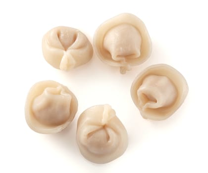 Five isolated prepared dumplings on the white background