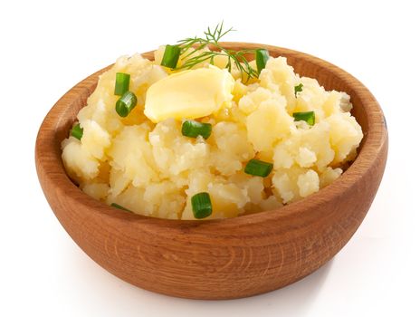 Mashed potatoes with butter dill and green onion in the wooden bowl