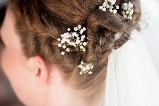wedding hairstyle bride flowers stylist hair artist bridal