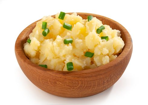 Mashed potatoes with green onion in the wooden bowl