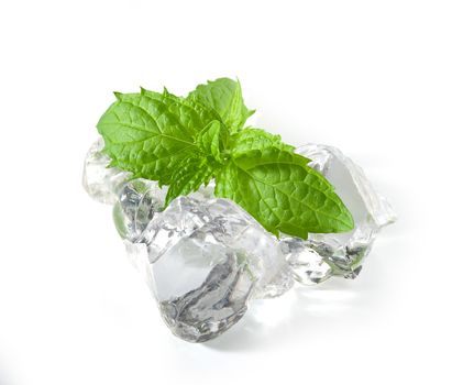 Fresh green leaves of mint with ice cubes on the white