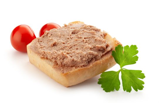 Isolated sandwich with meat pate, tomatoes and leaf of parsley