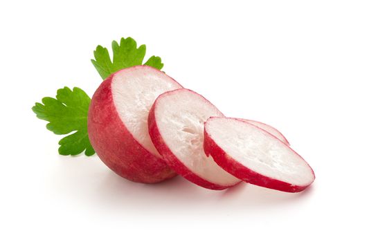 Isolated sliced fresh radish with parsley on the white