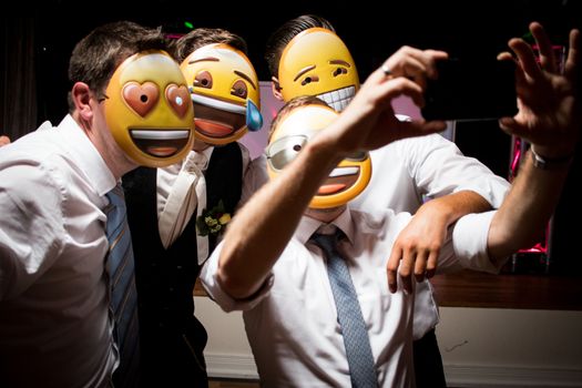 selfie friends men group men with emoji mask fun on bachelor party