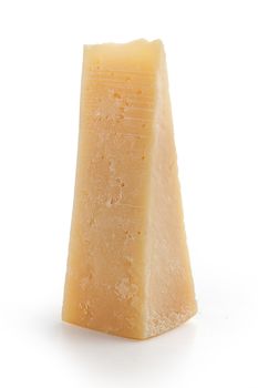 Isolated slice of parmesan cheese on the white background