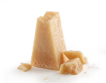 Isolated pieces of parmesan cheese on the white background
