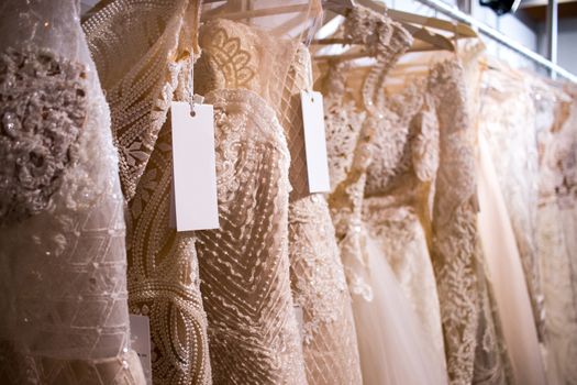 wedding dresses on clothes rail hanging rail fair trade bridal week 