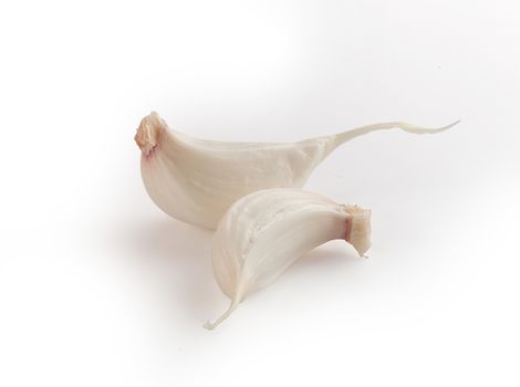 Isolated two cloves of young garlic on the white background