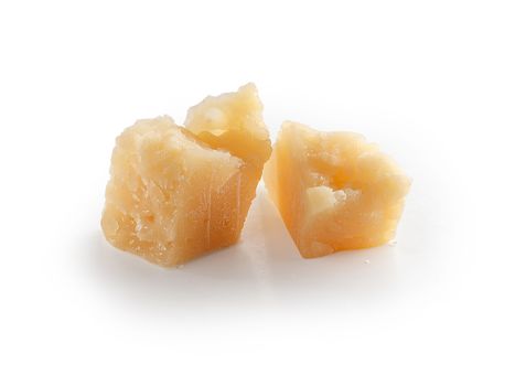 Isolated slice of parmesan cheese on the white background