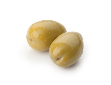 Isolated two marinated green olives on the white background