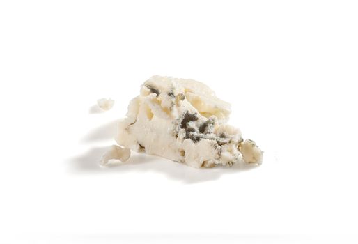 Isolated piece of blue cheese on the white