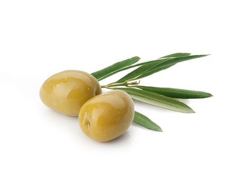 Isolated two marinated green olives with leaves on the white background
