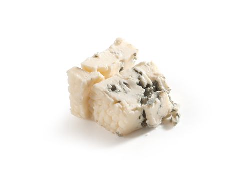 Isolated pieces of blue cheese on the white