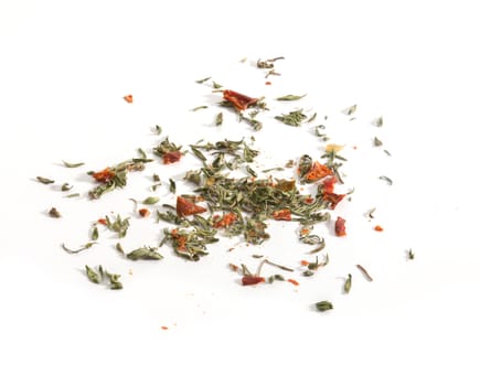 Dried red and green herbs on the white background