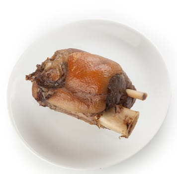 Roasted pork knuckle on the white plate