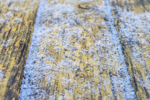 wooden boards covered with snow