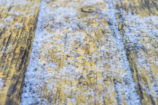 wooden boards covered with snow