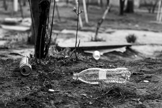 plastic bottle and garbage scattered on the street