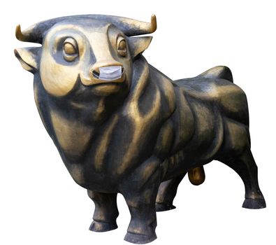 a bronze bull sculpture in a medical mask is protected against coronavirus