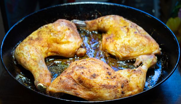 delicious baked chicken breasts in a frying pan