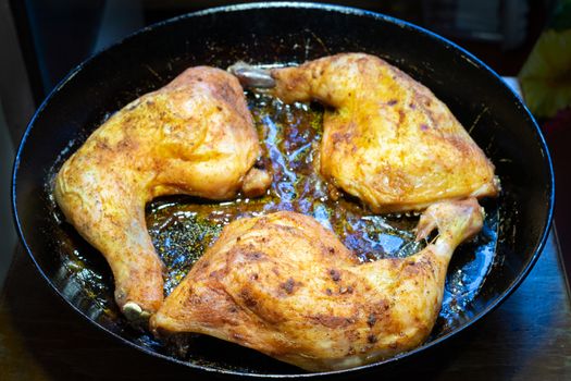 delicious baked chicken breasts in a frying pan