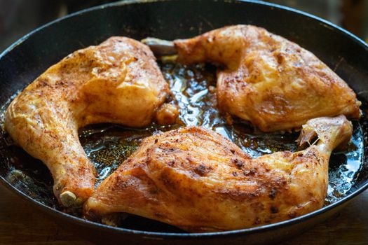 delicious baked chicken breasts in a frying pan