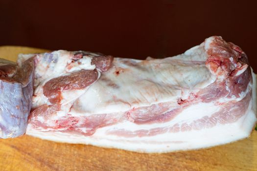 a large piece of raw pork fat germinated with meat