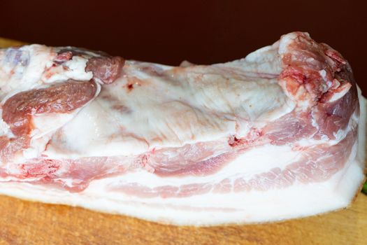 a large piece of raw pork fat germinated with meat