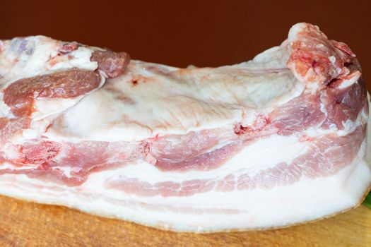 a large piece of raw pork fat germinated with meat