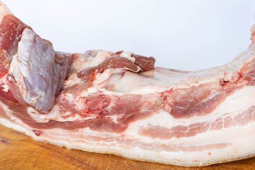 a large piece of raw pork fat germinated with meat