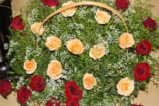 basket with red and yellow roses