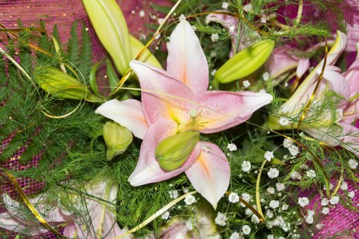 bouquet of pink flowers with greenery