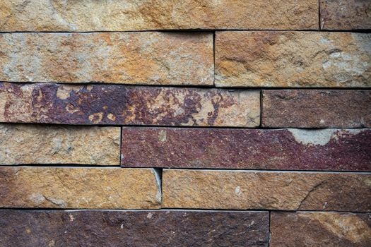 Ancient wall made of darkened red brick