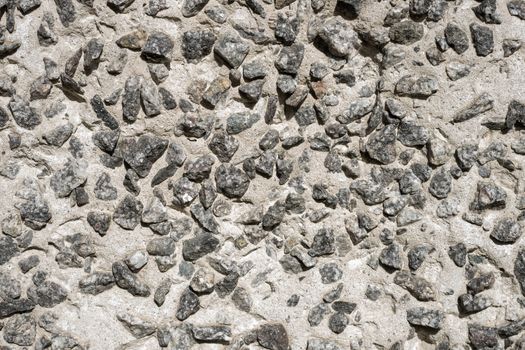 Background: Concrete product made of large granite rubble